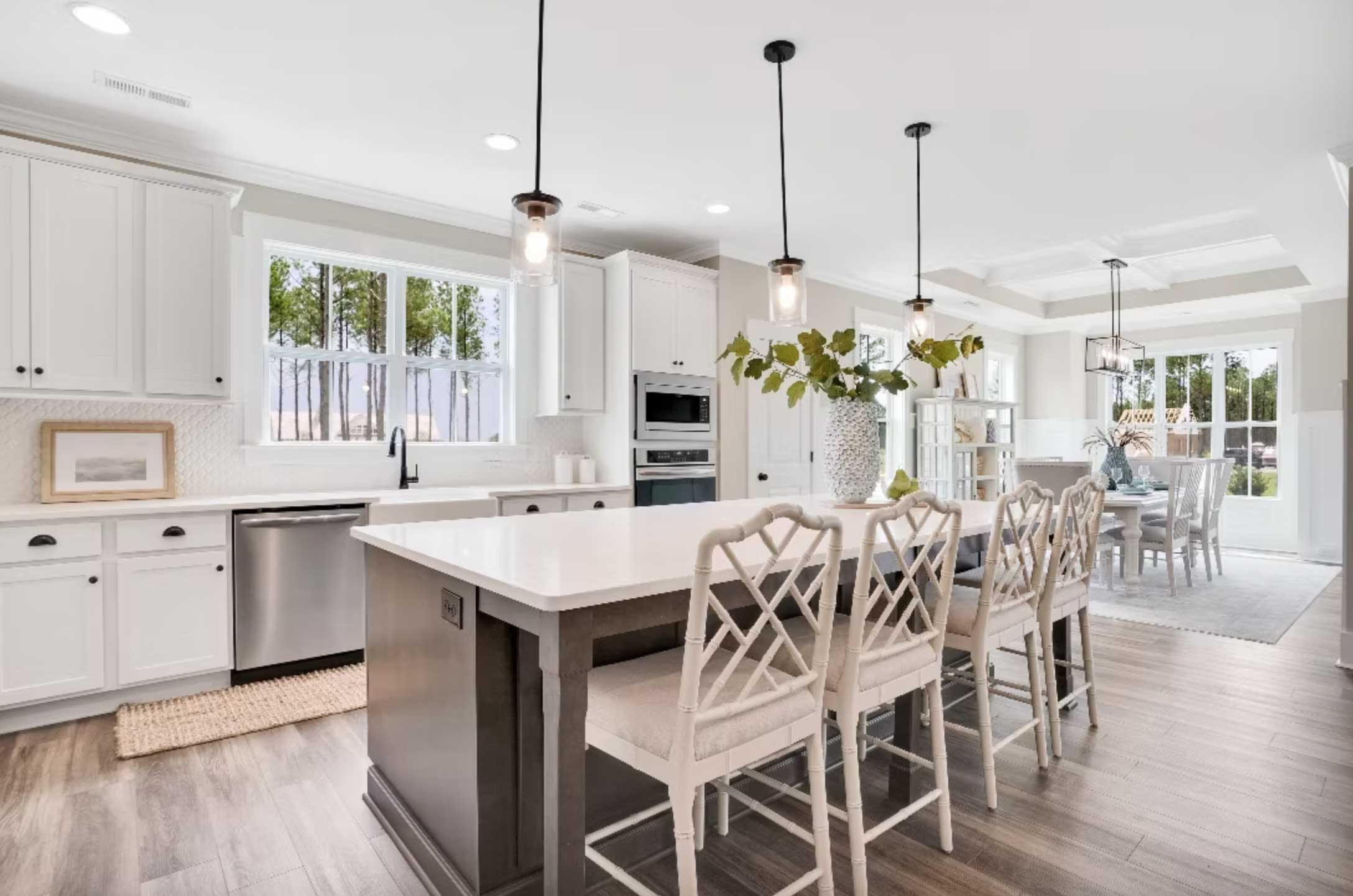 Kitchen with navy island in a Legacy home