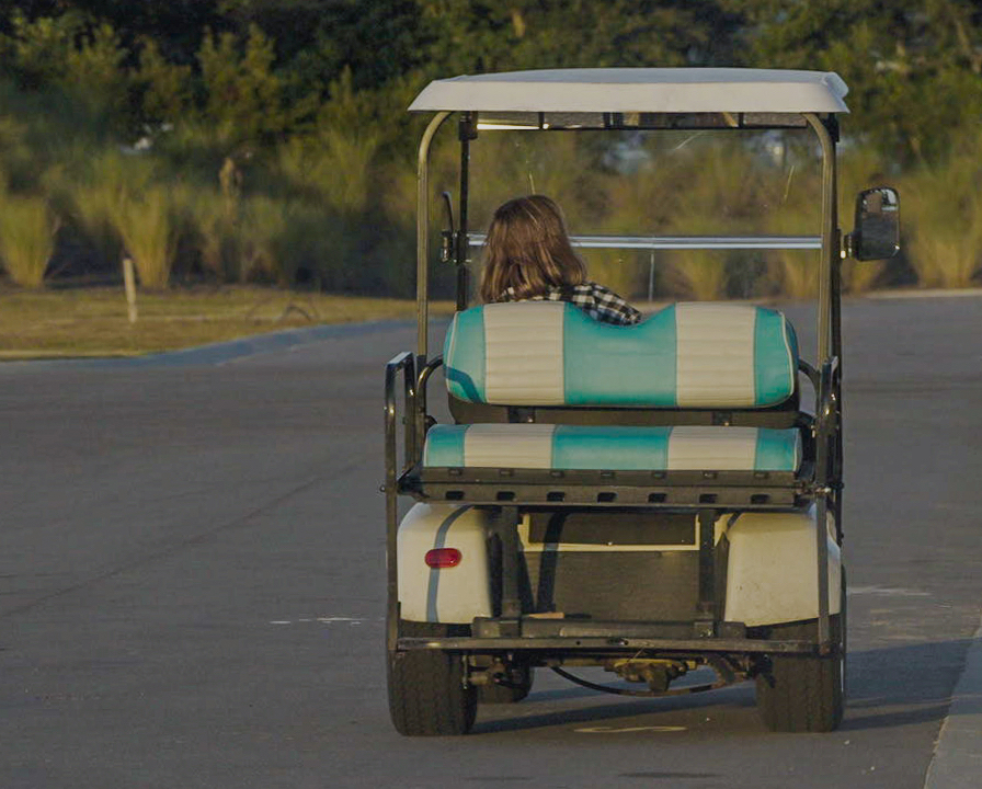 Golf cart on a community street